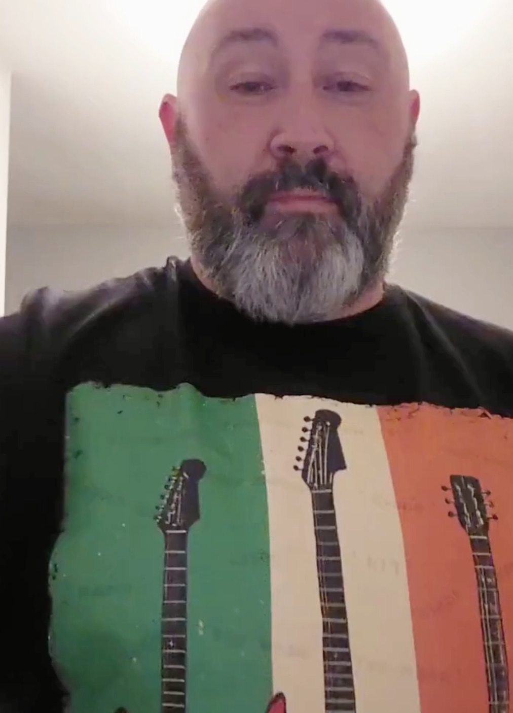 Cathal wearing a Gaelic Generations Irish guitar T-shirt