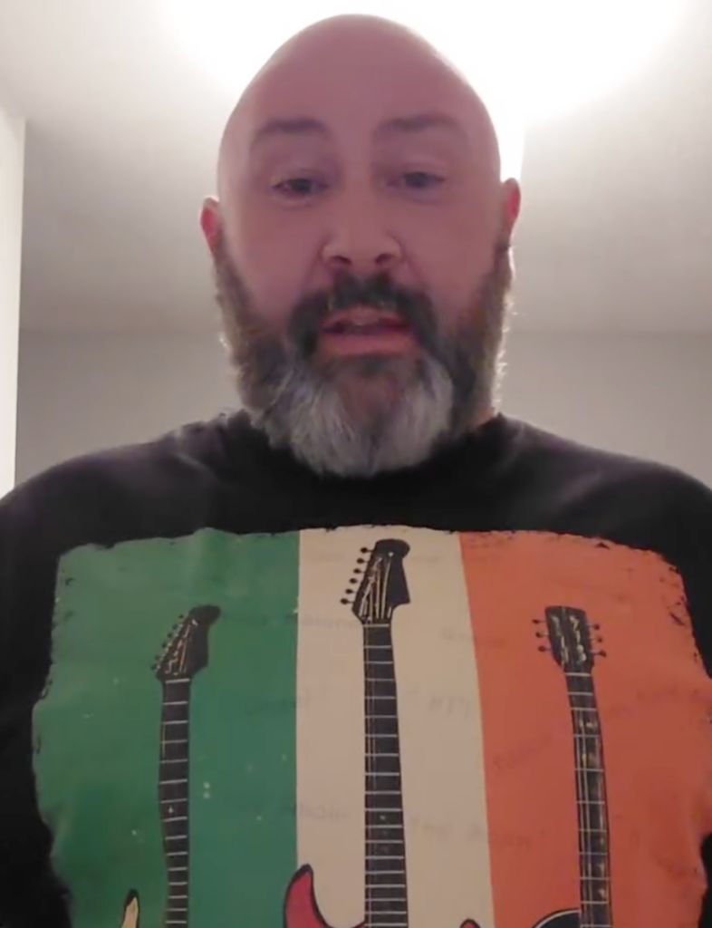 Irish musician Cathal Daly wearing an Irish Rock Guitar T-shirt.