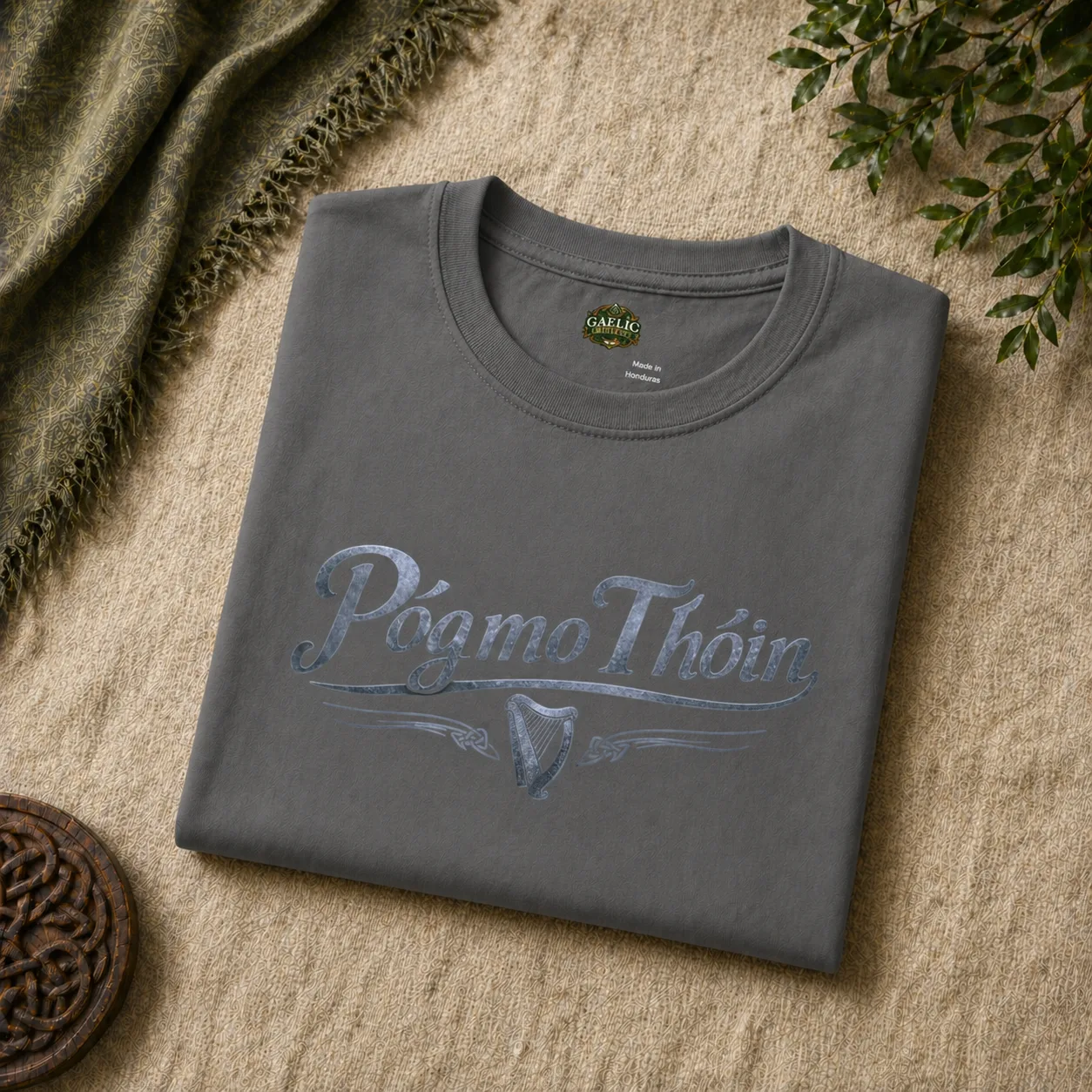 Folded image of charcoal póg mo thóin t-shirt