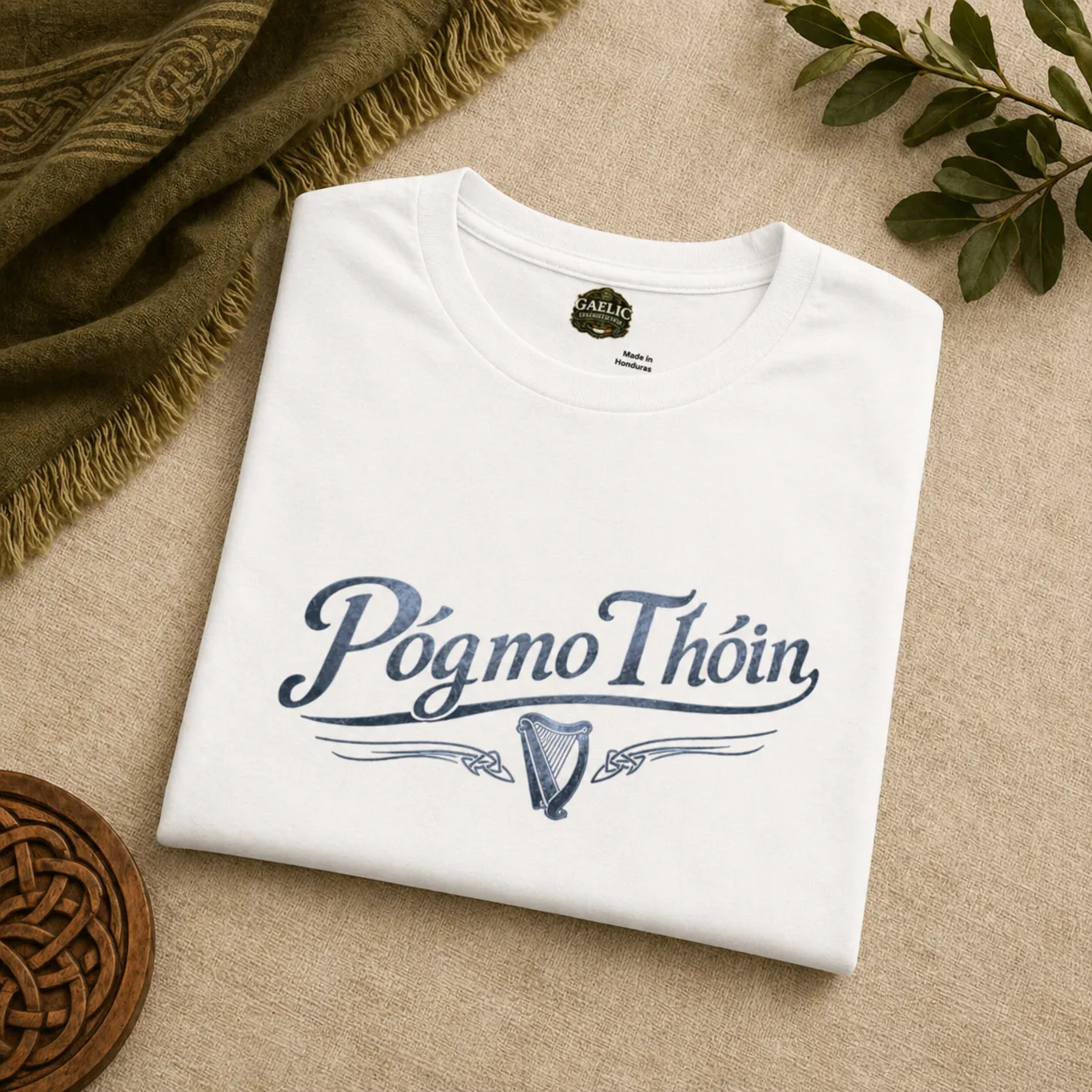 Folded image of white póg mo thóin t-shirt