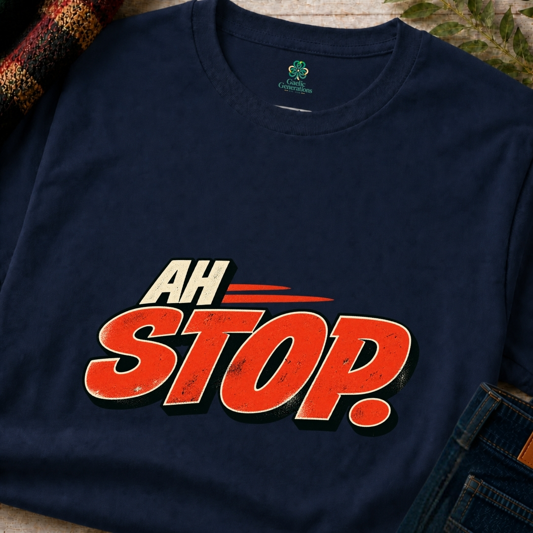 Navy blue Ah Stop Irish saying T-shirt shown in close-up with oversized distressed red-orange typography and cream accents