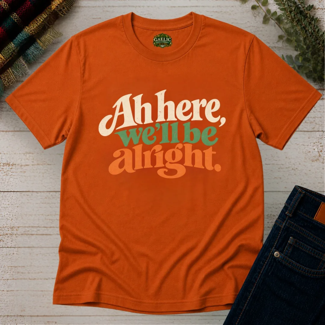 Orange Ah Here, We’ll Be Alright Irish T-Shirt front view with retro cream, green and orange print