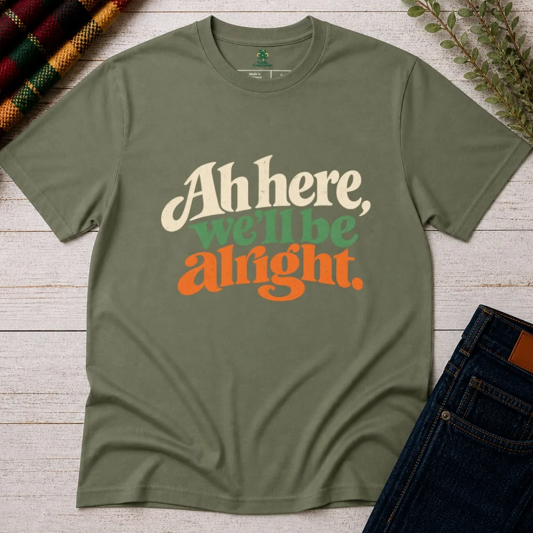 1. Military Green Ah Here, We’ll Be Alright Irish T-Shirt front view with cream, green and orange lettering
