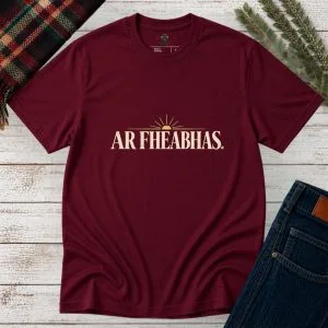 Maroon Ar Fheabhas Irish language T-shirt with cream vintage lettering and sunrise graphic