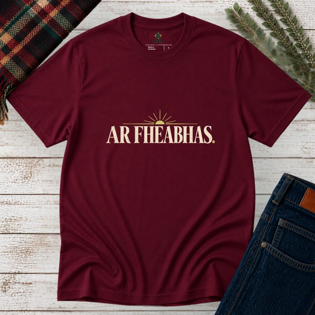 Maroon Ar Fheabhas Irish language T-shirt with cream vintage lettering and sunrise graphic