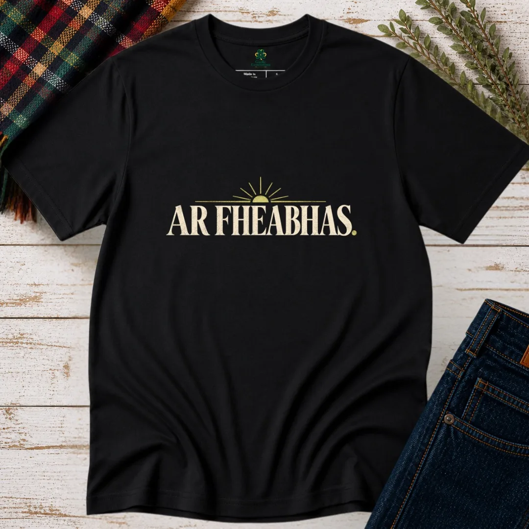 Black Ar Fheabhas Irish language T-shirt with cream vintage typography and sunrise graphic