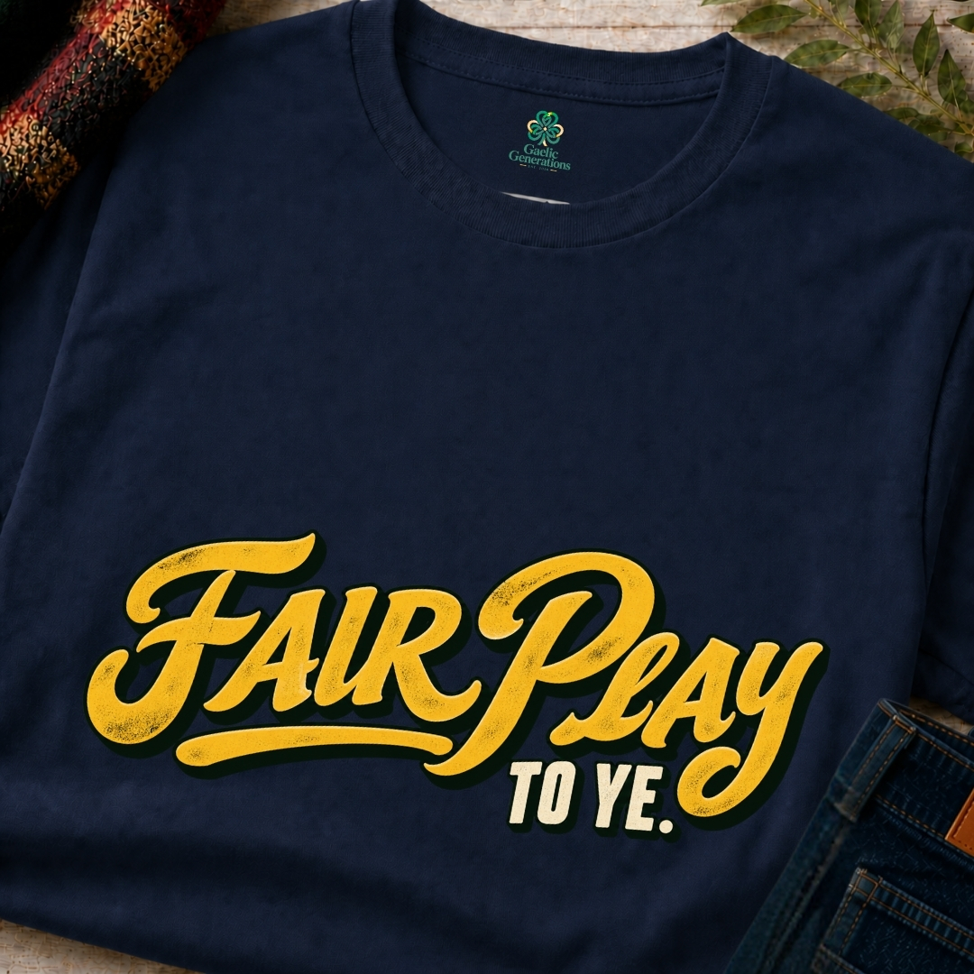 Close-up of navy blue Fair Play To Ye Irish saying T-shirt featuring golden-yellow script and cream lettering with a retro finish