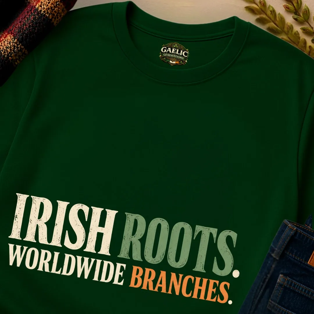 Close-up of the Forest Green Irish Roots Worldwide Branches T-Shirt with cream, green and orange lettering