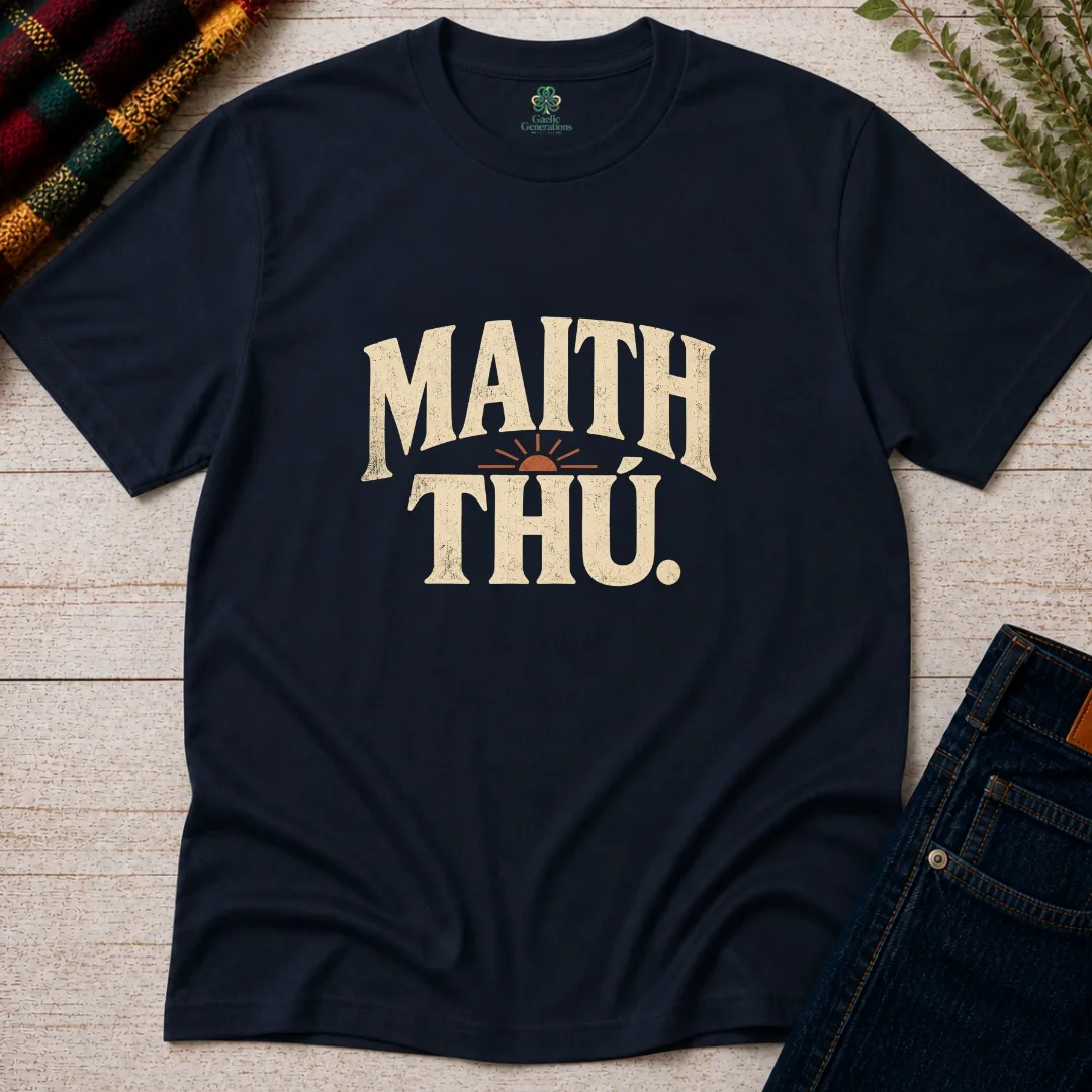 Navy Maith Thú Gaeilge T-shirt with cream vintage typography and rust sunrise graphic