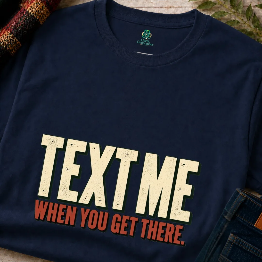 Close-up of navy Text Me When You Get There T-shirt with distressed cream and rust lettering