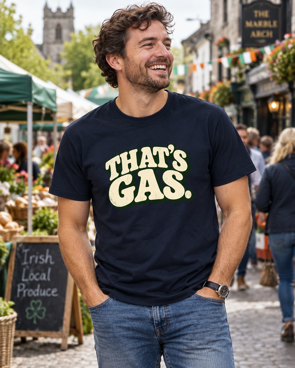Man wearing a navy That's Gas T-shirt while walking through an Irish Market