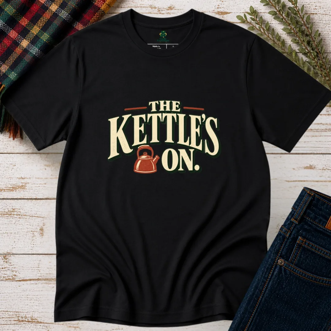 Black The Kettle’s On Irish saying T-shirt with cream vintage lettering and rust kettle graphic